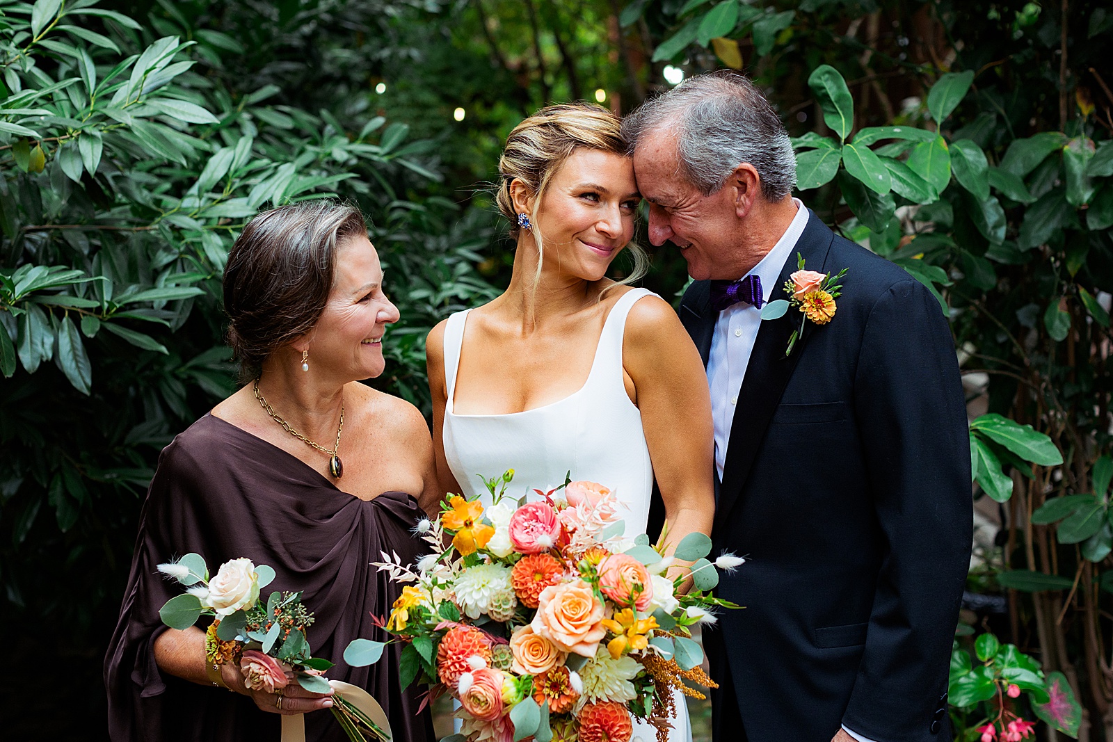 bride has a tender moment with her parents