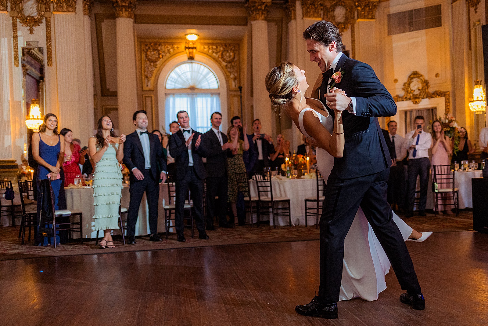 Groom dips brides during first dance
