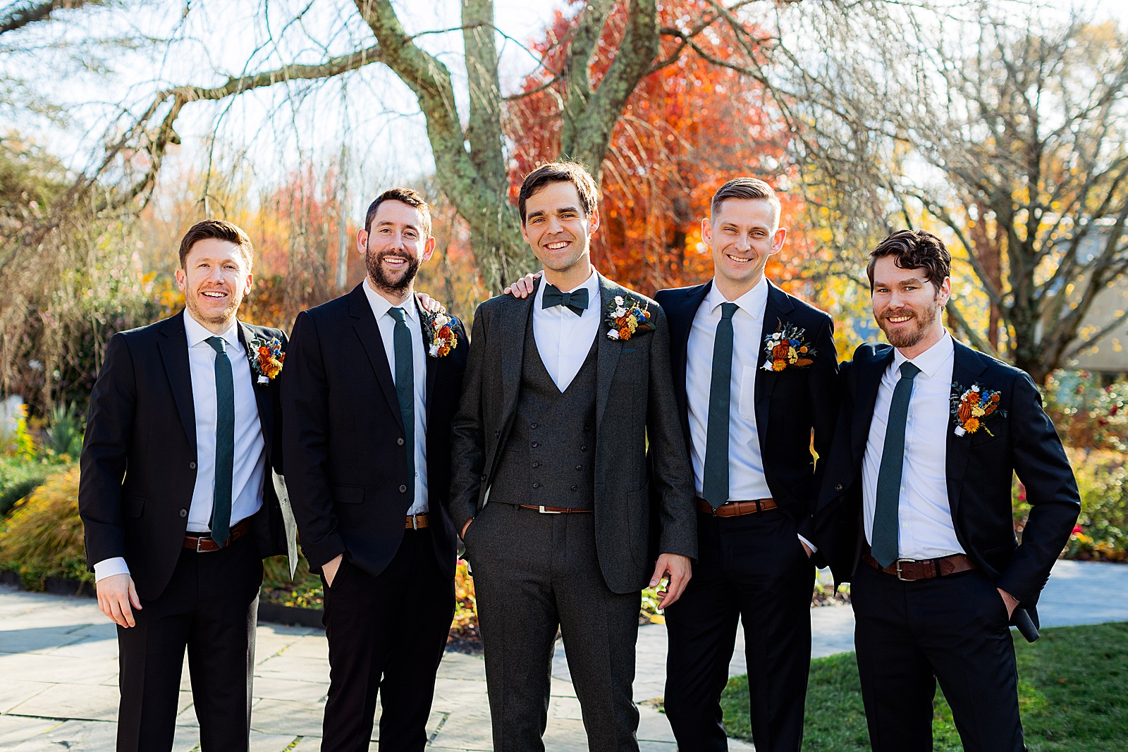Groom and four groomsmen pose at Historic London Town and Gardens.