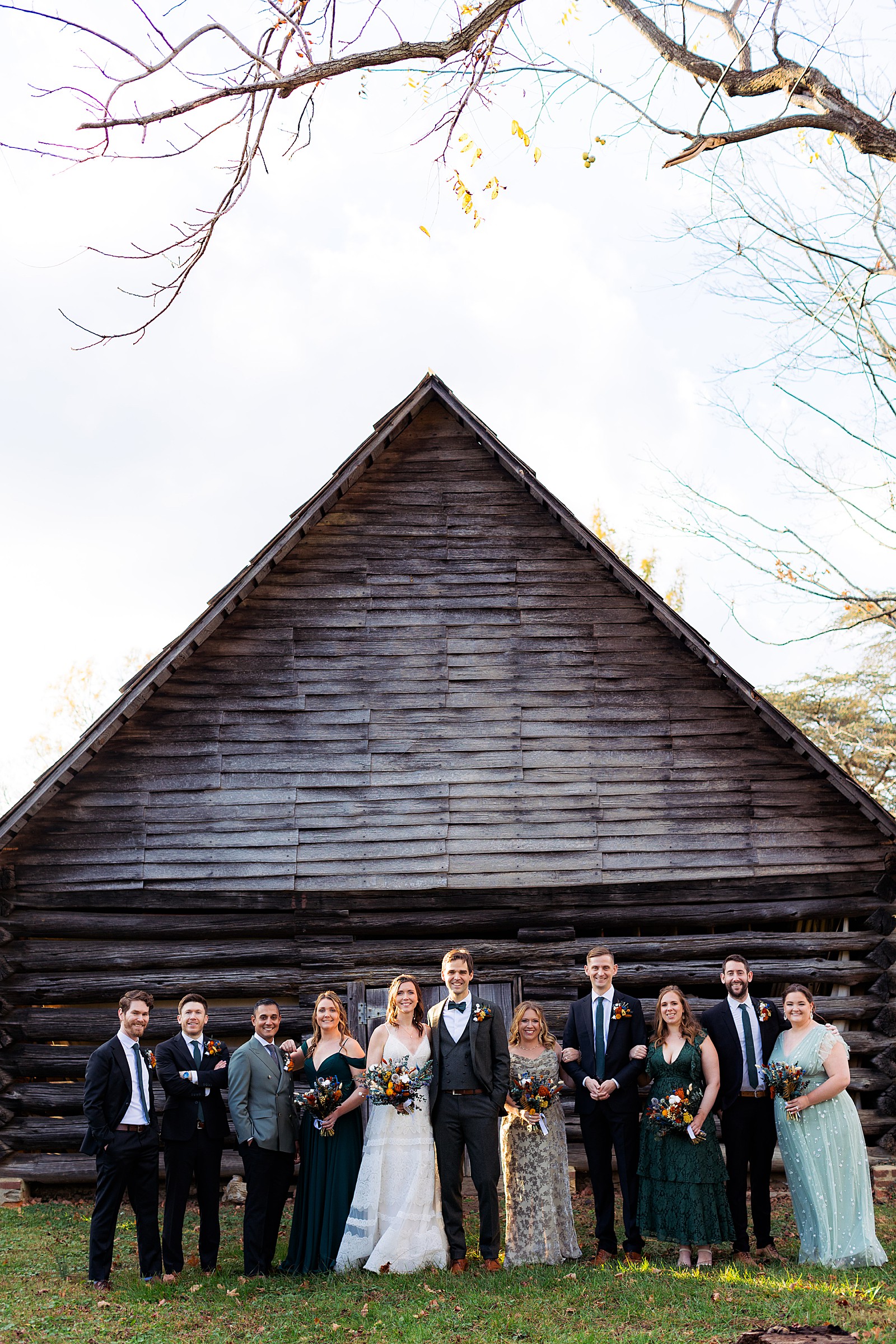 Entire wedding party poses during a fall London Town wedding photography session.