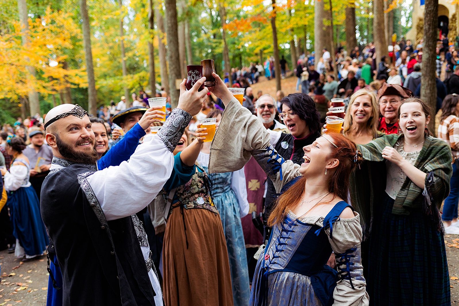 Huzzah! Bride and groom cheers with their guests after their MD Renn Fest wedding.