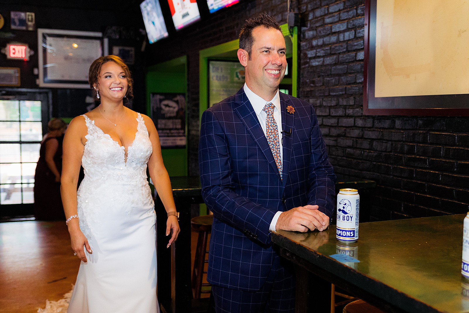 The bride and groom prepare to see each other and do their first look at Pickles Pub in Baltimore. 