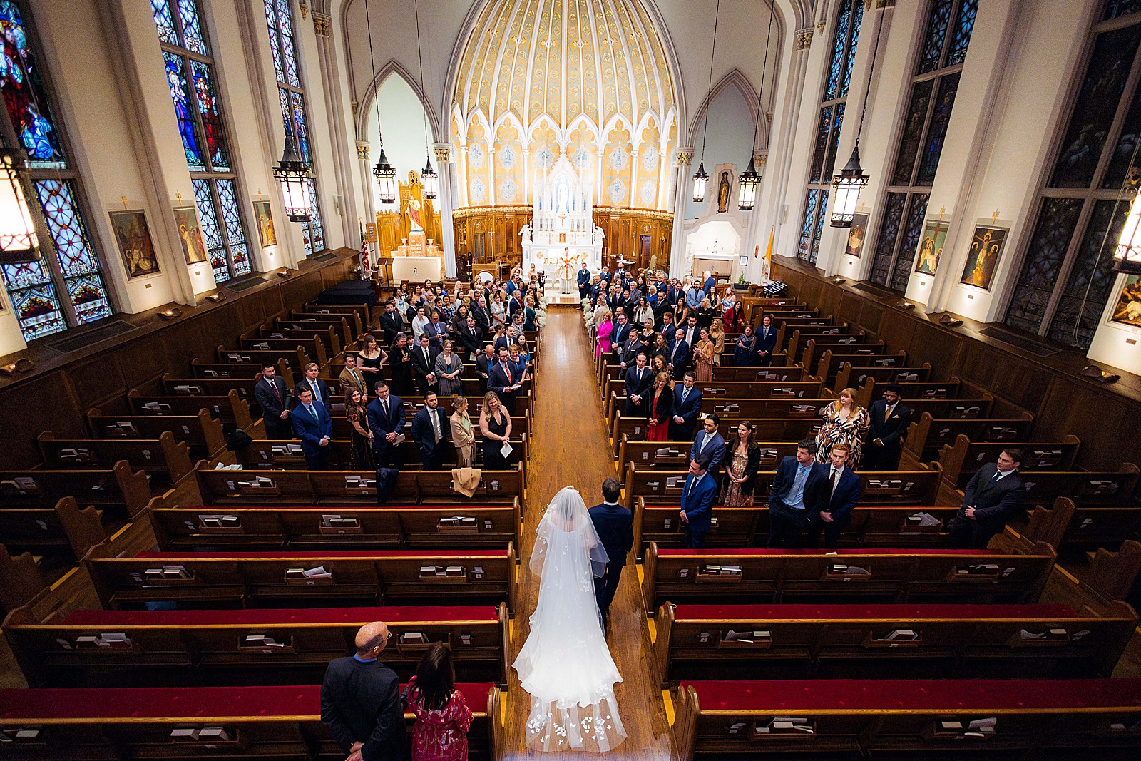 View from the balcony at Immaculate Conception church in DC as bride is walked down the aisle by her father.