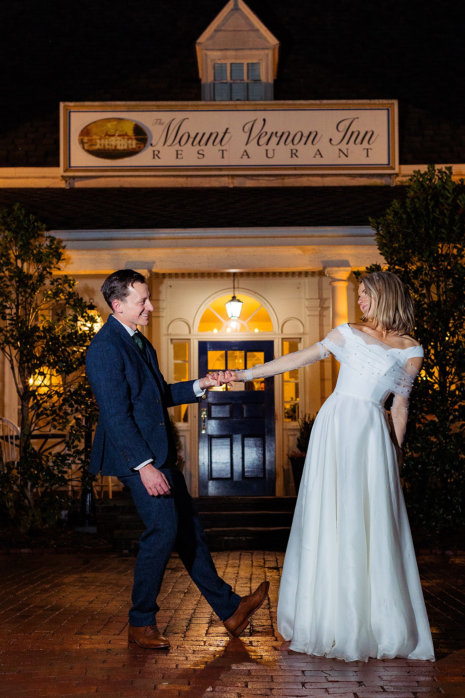 Bride and groom do a little outdoor dancing at their rainy Mount Vernon Inn Restaurant wedding.